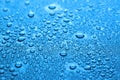 Many water drops on dark dusty blue background, closeup Royalty Free Stock Photo