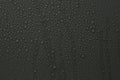 Many water drops on dark grey background Royalty Free Stock Photo