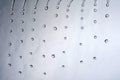 many water drops falling looking like rain or a shower Royalty Free Stock Photo