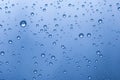 Many waterdrops of different size on a blue background Royalty Free Stock Photo
