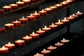 Many wax candles lit in the Church during mass Royalty Free Stock Photo