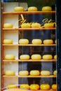 Many wheels of Dutch cheese on shop-window in Amsterdam, the Netherlands Royalty Free Stock Photo