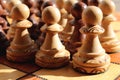 Many white and black pawns figures stand on a chess board Royalty Free Stock Photo