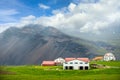 Many white buildings and red roofs are factories and pastures. In the countryside of Iceland