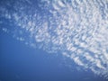 Many white clouds and a moon in sky Royalty Free Stock Photo