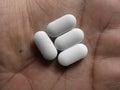 Many white color oblong shape medicine tablets