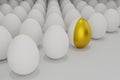 White eggs in a row with one golden egg Royalty Free Stock Photo