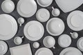Many white empty plate and cup on black background, close up Royalty Free Stock Photo
