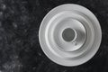 Many white empty plate and cup on black background, close up Royalty Free Stock Photo