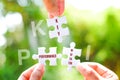 Many white jigsaw puzzle and KPI key performance indicator word on blue background - idea solution concept Royalty Free Stock Photo