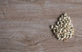 many white nuts on a right old wood grain table corner and take a closeup and top view. left copy space for text input, the photo Royalty Free Stock Photo