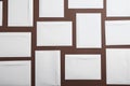 Many white paper envelopes on brown background, flat lay