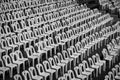 Many white plastic chairs in rows with black and white tone. Royalty Free Stock Photo