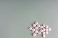 Many white tablets spilling out of package, Close up pills spilling out of pill bottle on blue background