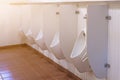 Many white urinals in the male bathroom modern style used in public health Royalty Free Stock Photo