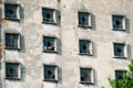 Many windows on the facade of the old building. Monotone architecture Royalty Free Stock Photo