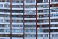 Many windows in a multi-storey building with balconies