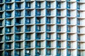 Many windows of a tall tower building with air conditioners close-up Royalty Free Stock Photo