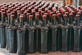 Many wine bottles arranged neatly