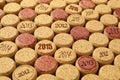 Many wine corks with different dates as background, closeup Royalty Free Stock Photo