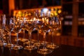 Many wine glasses on the bar with brilliance and light Royalty Free Stock Photo
