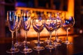 Many wine glasses on the bar with brilliance and light Royalty Free Stock Photo