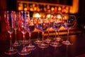 Many wine glasses on the bar with brilliance and light Royalty Free Stock Photo