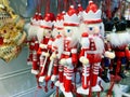 Many wooden handmade nutcrackers as christmas decor for fir tree hanging at christmas market fair