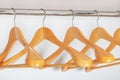 Many wooden hangers in the closet white, side view