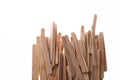 Many wooden ice cream sticks in chaotically row on white background isolated, flat lay bottom Royalty Free Stock Photo