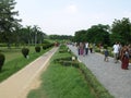 Many worshipers make their way to the Lotus Temple through the entrance park