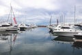 Many Yachts moored in harbour at Wharf Newcastle against cloudy Royalty Free Stock Photo