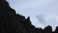 Many young ibex or alpine mountain goat standing in silhouette on a jagged mountain ridge