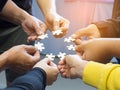 Many young people hands holding jigsaw puzzle pieces in circle Royalty Free Stock Photo