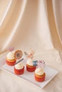 Many yummy cupcakes on table on light background