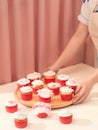 Many yummy cupcakes. Valentine sweet love cupcake on table on light background