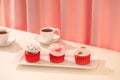 Many yummy cupcakes. Valentine sweet love cupcake on table on light background