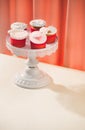 Many yummy cupcakes. Valentine sweet love cupcake on table on light background