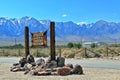 Manzanar War Relocation Center National Historic Site with Entrance Sign and Community Hall below Sierra Nevada, California