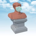 Mao Zedong sculpture with surgeon mask