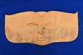 Maori man face wood carving sculpture