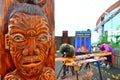 Maori men carve a Maori Wood carving Royalty Free Stock Photo