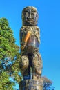 Maori wood carving. Male figure on pole, Tauranga, New Zealand Royalty Free Stock Photo