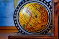Map of Africa on an ancient globe with world map in the background Royalty Free Stock Photo