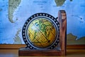 Map of Africa on an ancient globe with world map in the background Royalty Free Stock Photo