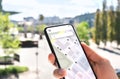 Map app in mobile phone to search location or navigate to destination in city. Place marker and pointer icon. Online GPS guide. Royalty Free Stock Photo