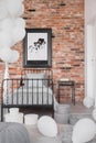 Map in black frame on brick wall in classy bedroom interior with industrial single bed with grey bedding and bunch of white Royalty Free Stock Photo