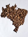 map of Brazil with roasted coffee beans and white background