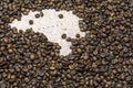 Map of Brazil under a background of coffee beans