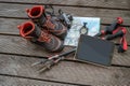 Map, compass, camera, touchpad and hiking poles and boots for tr